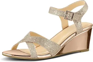 Elegant champagne gold glitter wedge sandals featuring a metallic heel and adjustable ankle strap