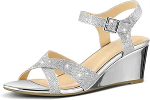 Detailed side profile of sparkling silver glitter wedge sandals featuring ankle strap buckle