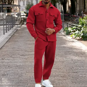 Red suede men's tracksuit set with button-up jacket and matching joggers outdoors.