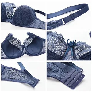 Dettagli ravvicinati del reggiseno in pizzo blu con spalline e ganci di chiusura