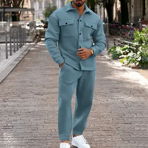 Full-body street view of a men's blue suede-like jacket and pants set on a model