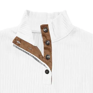 Close-up of white ribbed sweatshirt standing collar with brown suede button placket