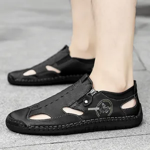 Men's casual black leather loafers with breathable cutouts and side zipper detail