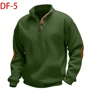 Detailed macro view of dark green men's ribbed knit sweatshirt with stand collar and buttons