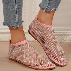Detail view of pink rhinestone mesh flat sandals with elegant bootie silhouette.