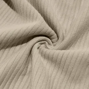 Close-up macro detail of beige heavy jacquard ribbed texture for men's winter sweatshirt.