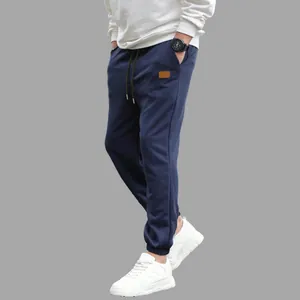 Side view of men's navy blue cargo sweatpants with drawstring and elastic cuffs