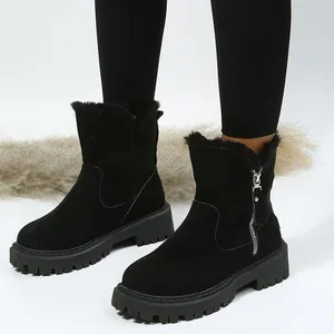 Bottes de neige noires en suédine avec semelle plateforme épaisse et fermeture éclair.