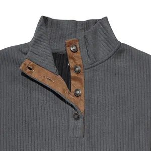 Close-up of men's mock neck jacquard sweatshirt with suede button placket detail