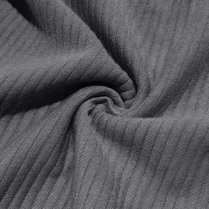 Detailed view of the heavy charcoal grey ribbed jacquard fabric texture