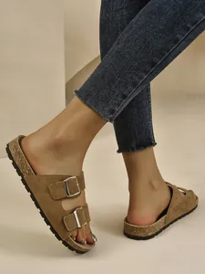 Detailed view of women's retro brown suede buckle sandals with cork platform sole