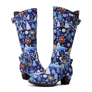 Detailed side view of blue Christmas boots with snowflake patterns and chunky heels