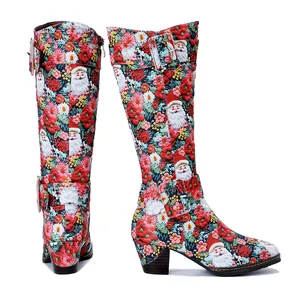 Detailed view of retro Santa Claus print high boots with comfortable chunky heels.