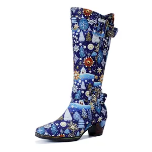 Detailed view of vintage Christmas snowflake print tall boots with chunky heels.