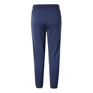 Back view of navy blue men's joggers featuring elastic waistband and cuffed ankles