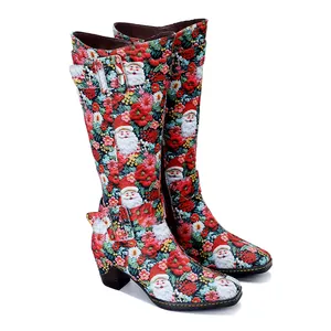 Detailed side view of high boots featuring vibrant Santa Claus and floral retro prints
