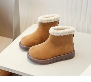Close-up of girls' warm suede snow boots with cozy fleece lining and back zipper detail