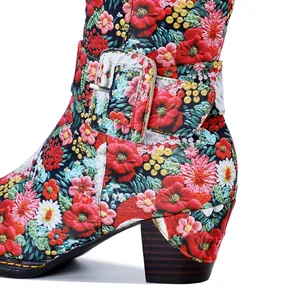 Macro detail of vintage floral print boots with chunky block heel and decorative side buckle