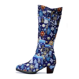 Detailed side view of vintage Christmas print knee-high boots with chunky heels