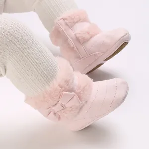 Adorable pink baby boots with soft plush lining and bow detail for 0-1 year old infants