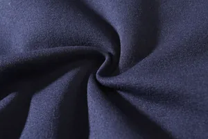 Macro view of high-quality navy blue fabric texture for men's outdoor cargo trousers