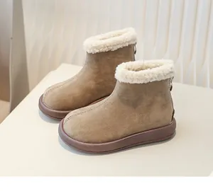 Detail view of children's warm snow boots with white faux fur lining and back zipper