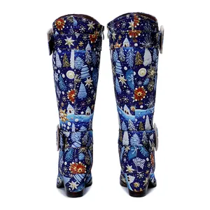 Detailed rear view of vintage Christmas print high boots with snowflake patterns and buckles.