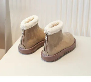 Macro detail view of children's fleece-lined snow boots with warm back zipper closure.