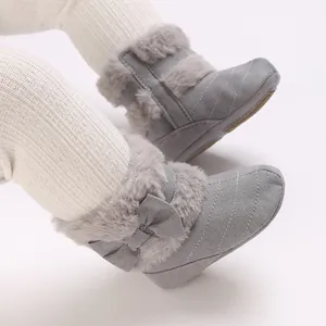 Detailed view of warm gray baby winter boots featuring soft faux fur and cute bow design