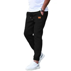 Men's casual black athletic joggers with drawstring waist and stylish leather patch