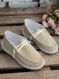 Lightweight women's canvas shoes with shimmering texture and decorative white laces