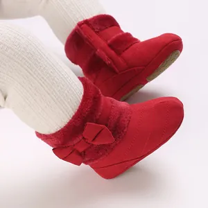 Festive red baby winter boots with soft soles, plush lining, and cute bow detail