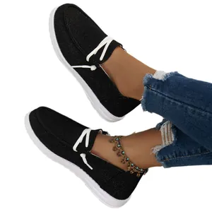 Elegant black casual canvas loafers for women featuring white sole and glitter finish