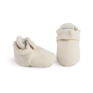 Soft cream colored fleece winter baby booties with warm lining for 0-1 year old infants
