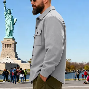 Detail of grey heavyweight button-down jacket showing fleece-lined texture and loose fit