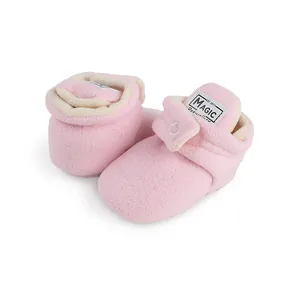 Close-up view of pink fleece-lined baby walking shoes for 0-1 year old winter warmth