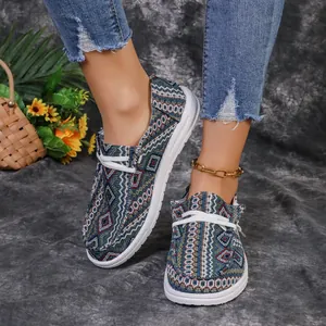Detailed view of patterned women's loafers featuring ethnic geometric prints and white soles