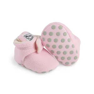 Cozy pink fleece baby walker shoes featuring anti-slip dotted soles and velcro straps