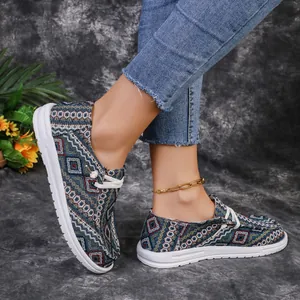 Detailed close-up of ethnic geometric pattern women's casual loafers with comfortable white soles