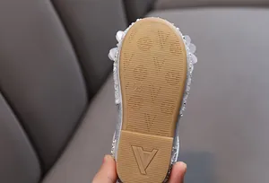 Detailed view of the non-slip rubber sole on girls' princess rhinestone dress shoes