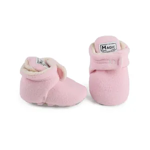 Soft pink winter warm fleece baby booties with adjustable magic tape closure for prewalkers