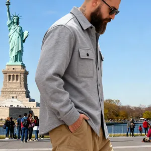 Men's heavy grey fleece workwear jacket shown outdoors with the Statue of Liberty