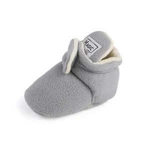 Soft grey fleece infant walker boots featuring warm white lining and magic walker tag
