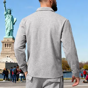 Back view of a heavyweight grey men's outdoor winter jacket at the Statue of Liberty