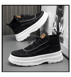 Detailed side view of black high-top sneakers featuring thick white soles and suede finish