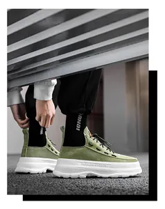 Detailed side view of olive green high-top platform men's sneakers with white thick sole