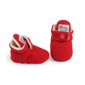 Vibrant red fleece baby prewalker boots featuring soft white lining and Magic label