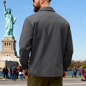 Detailed back view of heavy grey fleece-lined outdoor workwear jacket in outdoor setting
