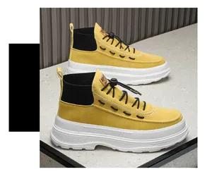 Detailed view of yellow high-top platform fashion boots with white chunky rubber sole