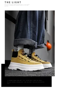 Modern men's high-top yellow casual boots with thick white soles shown in a street setting